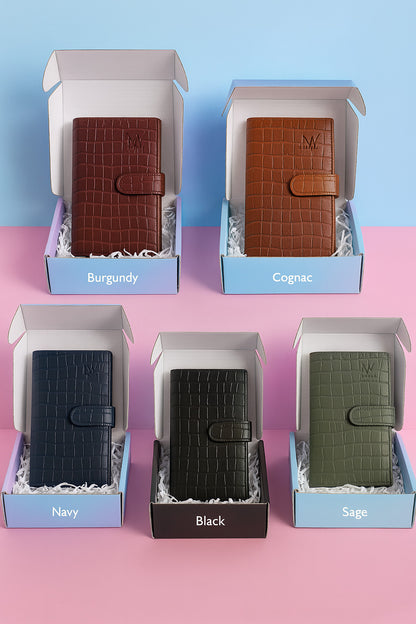 Five colorways of croc-embossed travel clutch in gift boxes