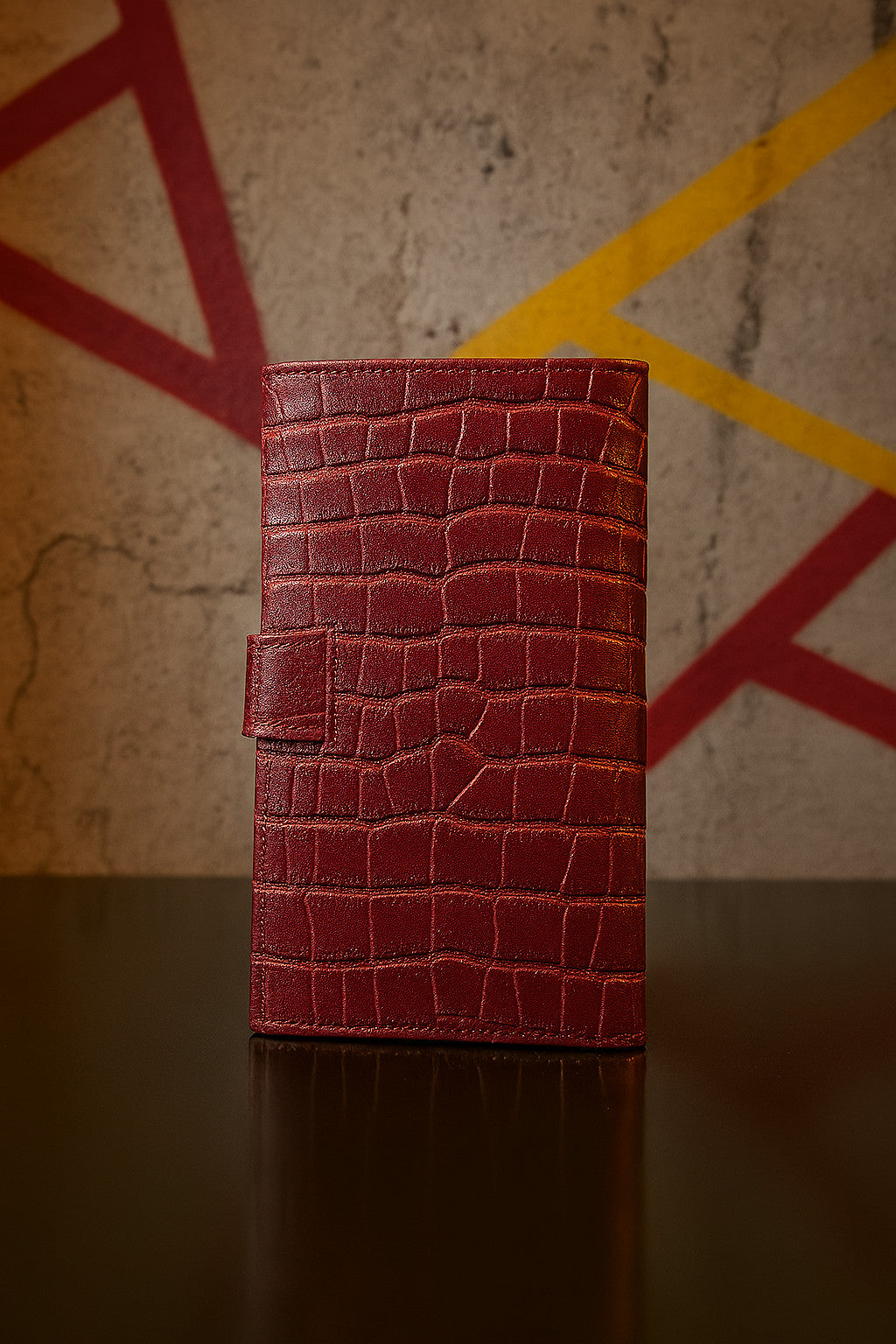 Croc-embossed leather travel clutch detail