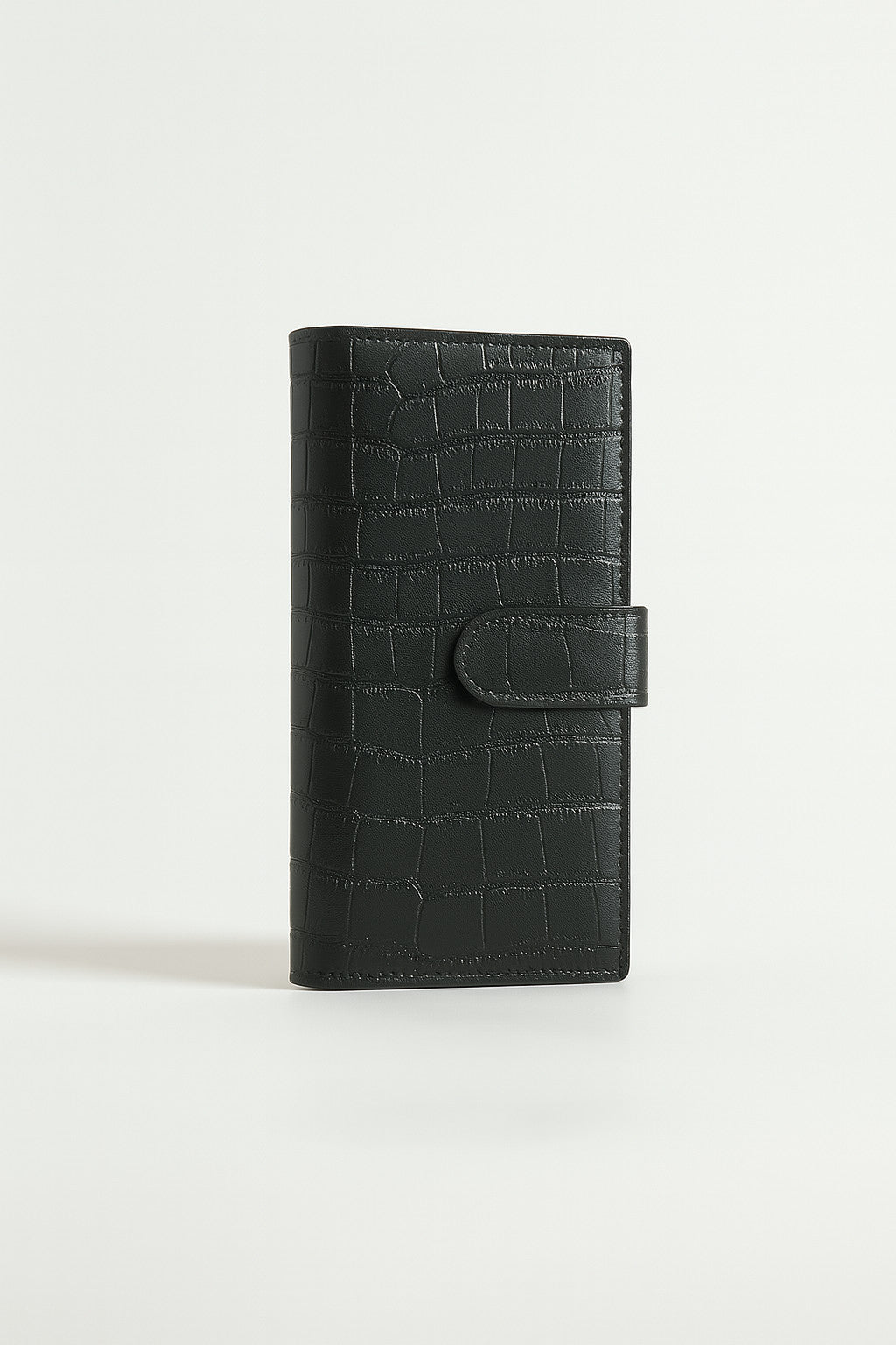 Croc-embossed leather travel clutch detail