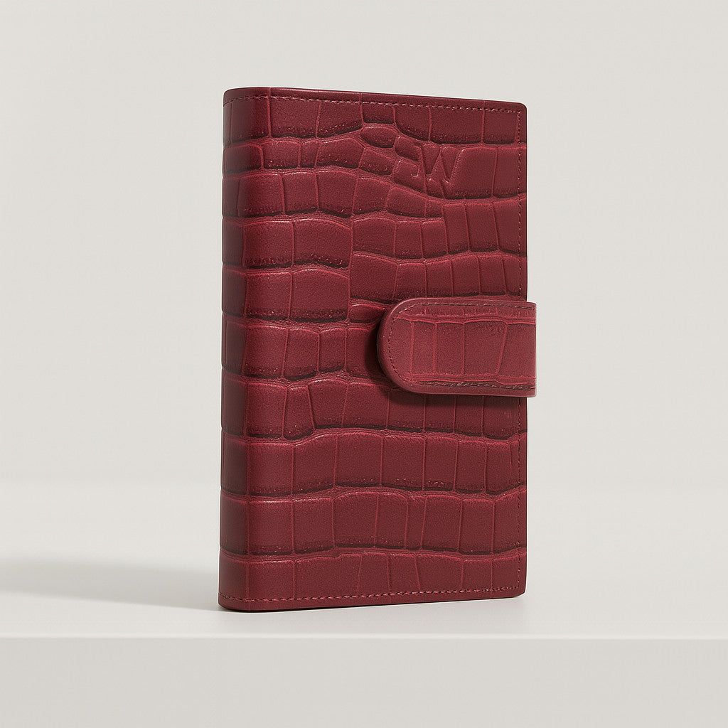 Croc-embossed leather travel clutch detail