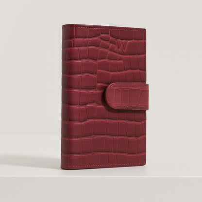 Croc-embossed leather travel clutch detail